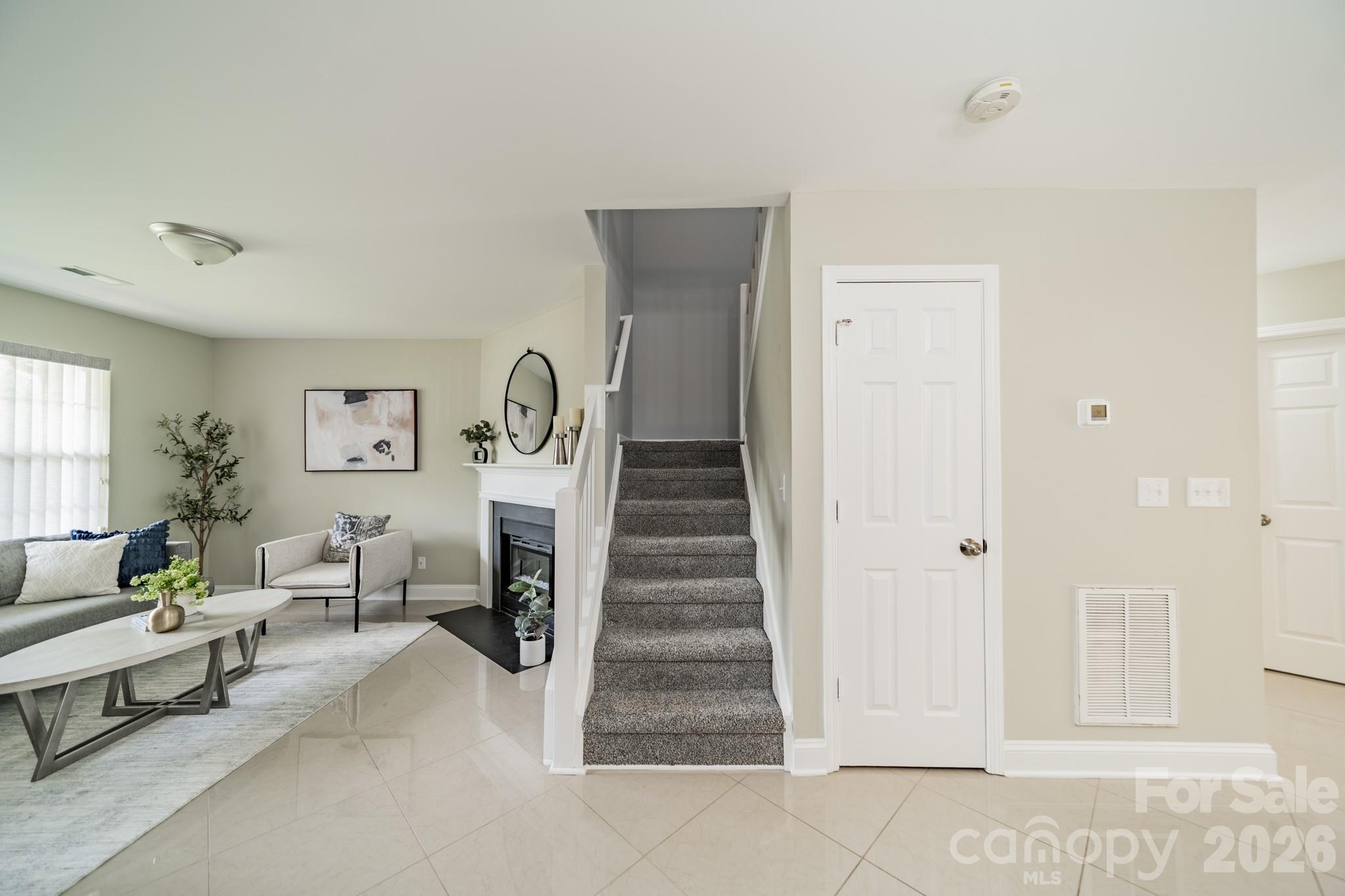 9226 Four Mile Creek Road Charlotte, NC 28277 - Photo 25 of 39 a living room with furniture and a fireplace