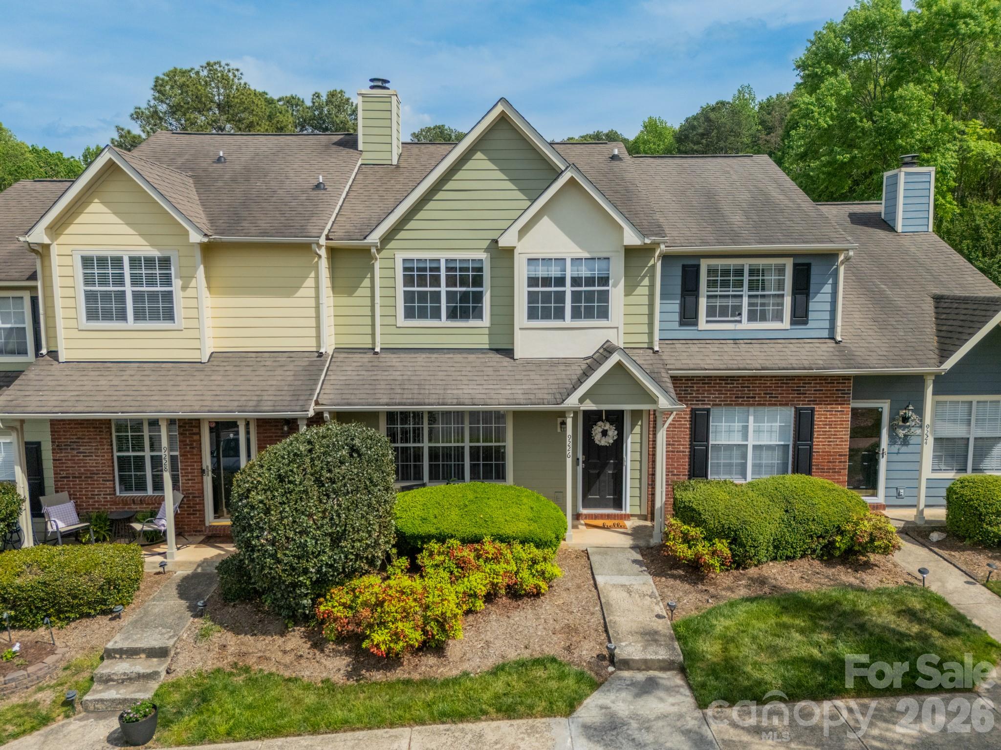 9226 Four Mile Creek Road Charlotte, NC 28277 - Photo 3 of 39 a front view of a house with a yard