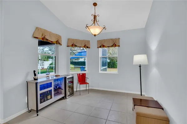 a very nice looking room with a large window and chandelier