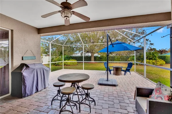 a view of a swimming pool and chairs in patio