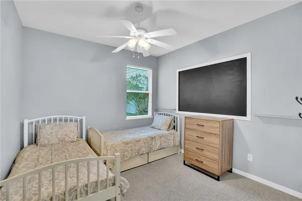 a bedroom with furniture and flat screen tv