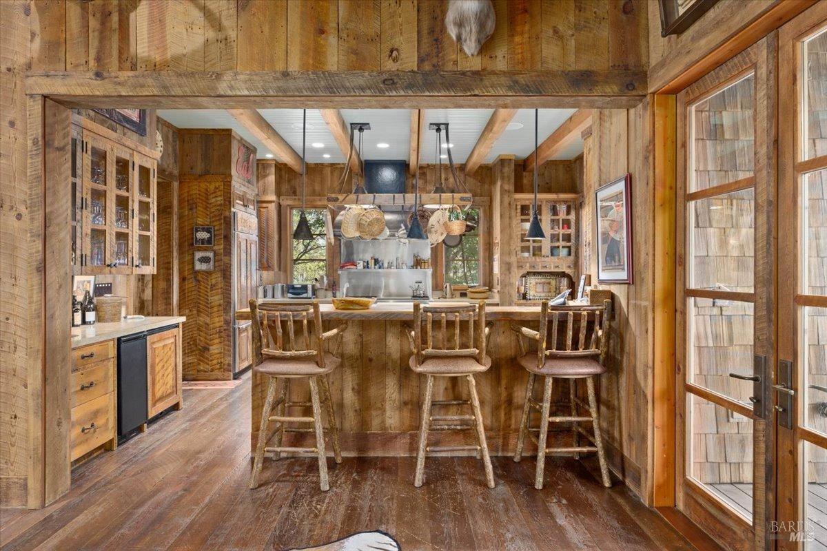 Undisclosed Address Burney, CA 96013 - Photo 11 of 39 a dining room with furniture a floor to ceiling window and wooden floor