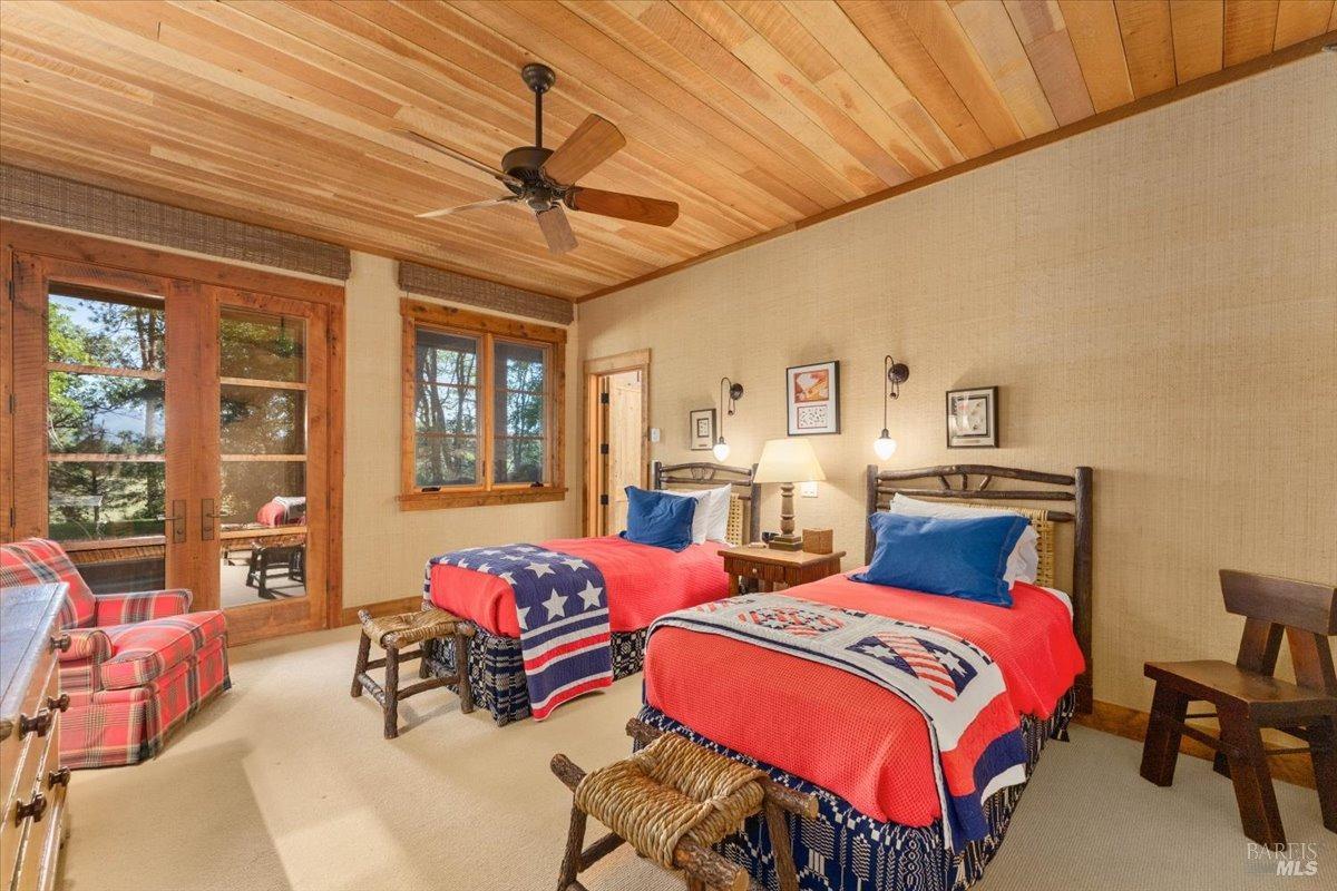 Undisclosed Address Burney, CA 96013 - Photo 17 of 39 a bedroom with two beds and a chandelier