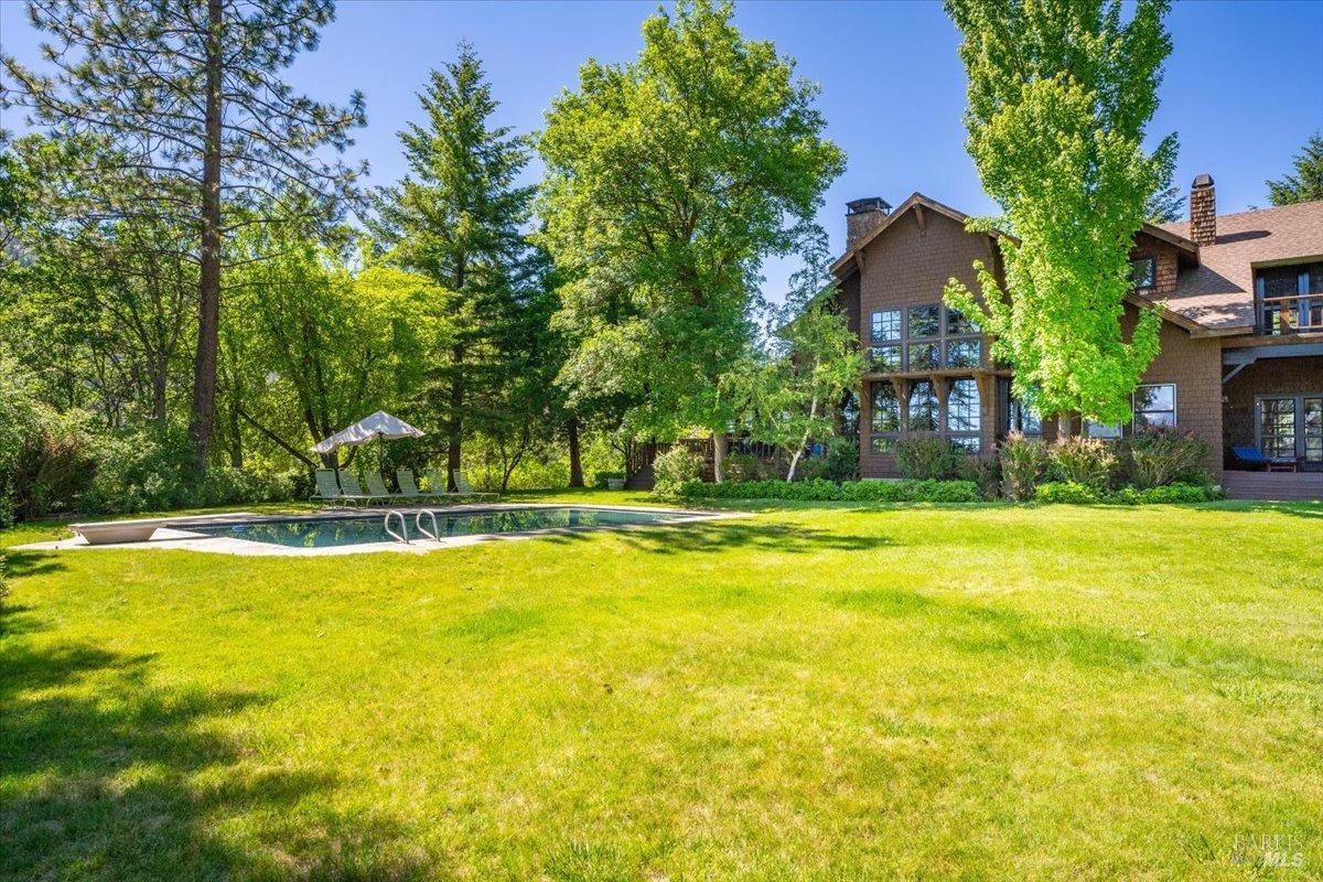 Undisclosed Address Burney, CA 96013 - Photo 20 of 39 a view of swimming pool and trees in the background