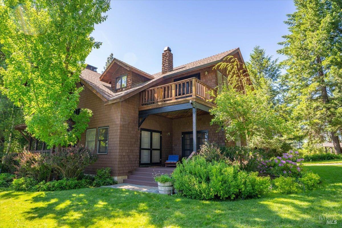 Undisclosed Address Burney, CA 96013 - Photo 21 of 39 a front view of a house with a yard