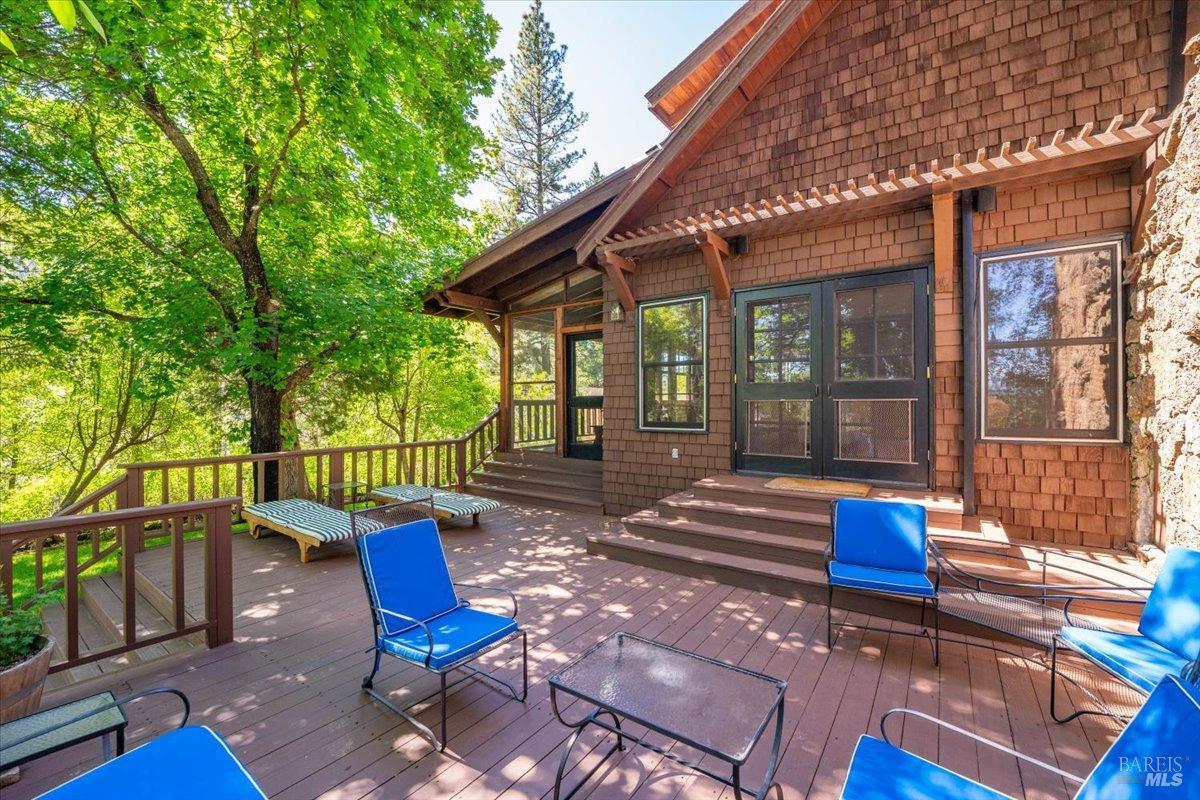 Undisclosed Address Burney, CA 96013 - Photo 27 of 39 a view of a house with a bench in the patio