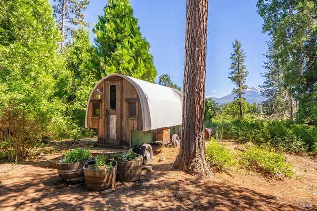 a view of a back yard with a patio