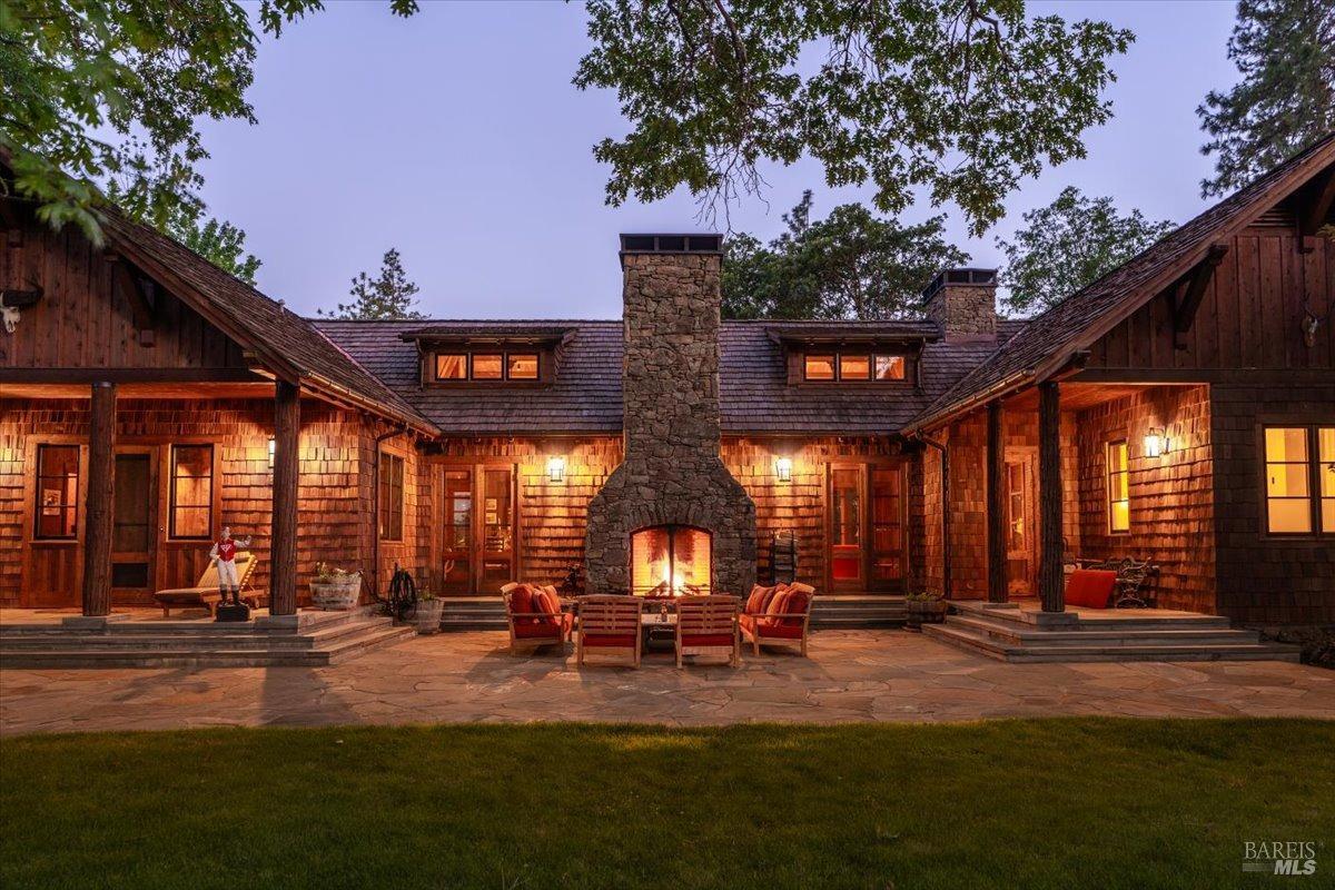 Undisclosed Address Burney, CA 96013 - Photo 7 of 39 a view of a patio with table and chairs and potted plants with large tree