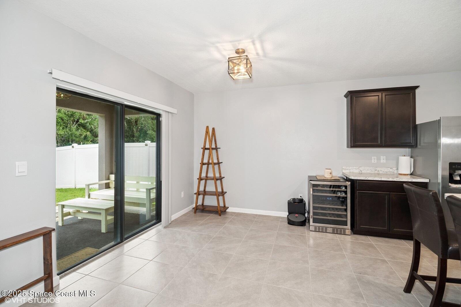 5221 Talbot Boulevard Cocoa, FL 32926 - Photo 11 of 32 a view of a livingroom with workspace and a window