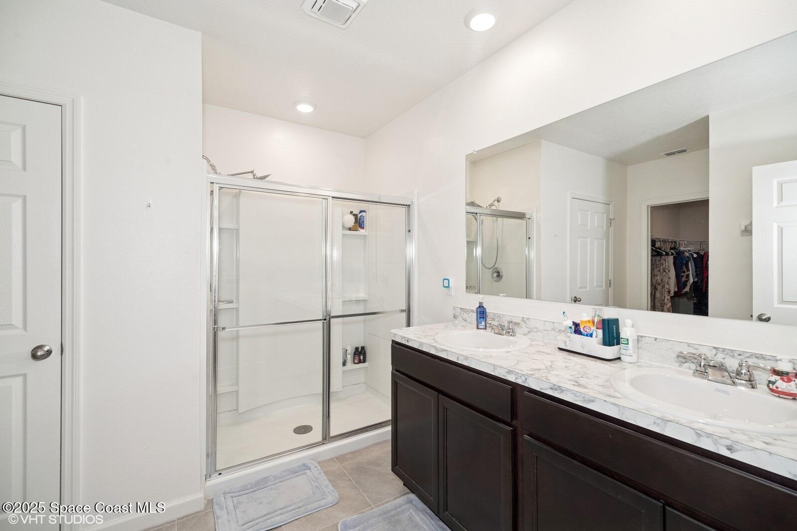 5221 Talbot Boulevard Cocoa, FL 32926 - Photo 17 of 32 a bathroom with a granite countertop sink mirror and double