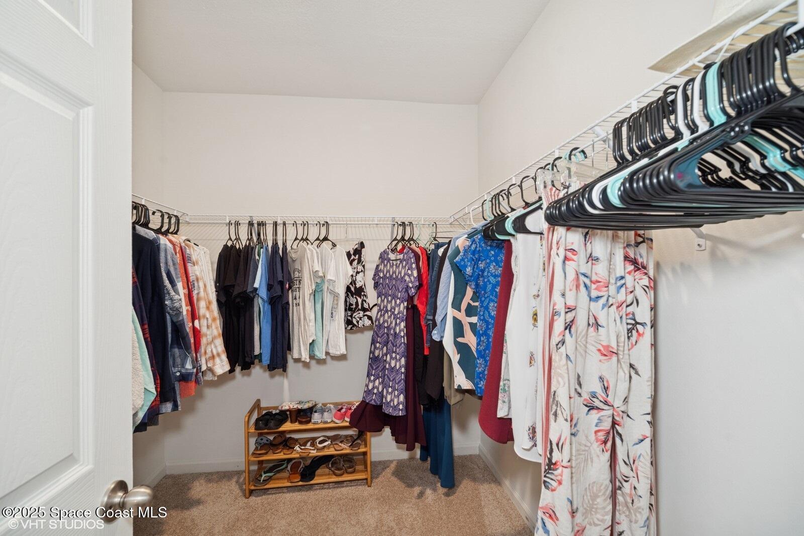 5221 Talbot Boulevard Cocoa, FL 32926 - Photo 18 of 32 a view of walk in closet with clothes