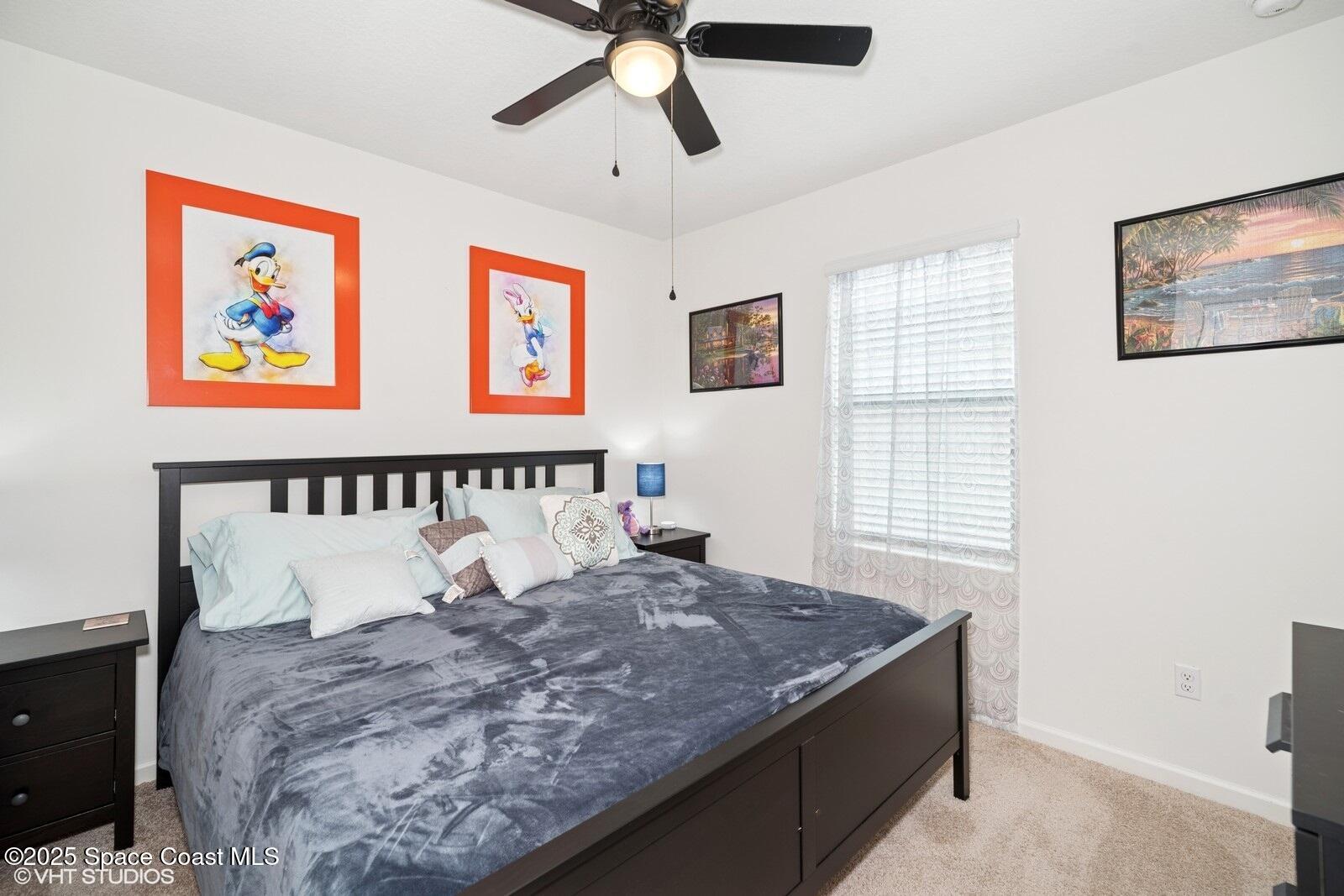 5221 Talbot Boulevard Cocoa, FL 32926 - Photo 19 of 32 a large bed sitting in a bedroom next to a window