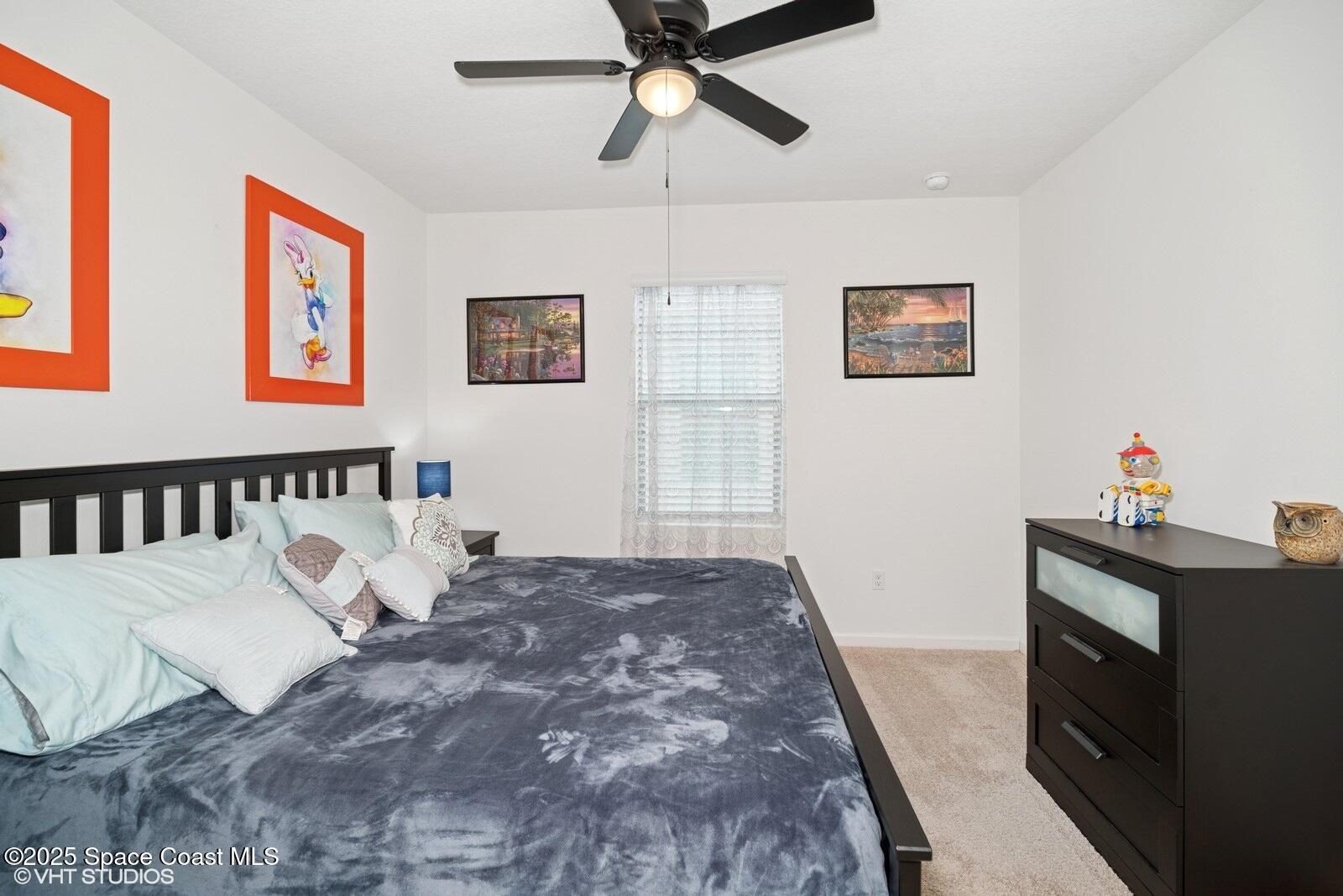 5221 Talbot Boulevard Cocoa, FL 32926 - Photo 21 of 32 a bed room with a bed and a window