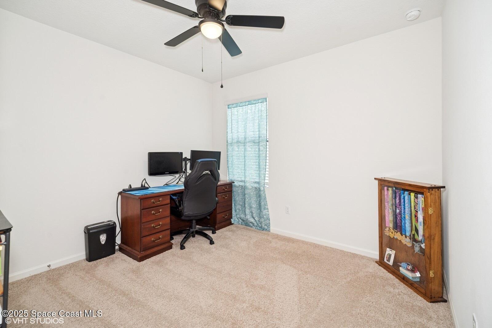 5221 Talbot Boulevard Cocoa, FL 32926 - Photo 22 of 32 a view of a workspace with furniture and a window