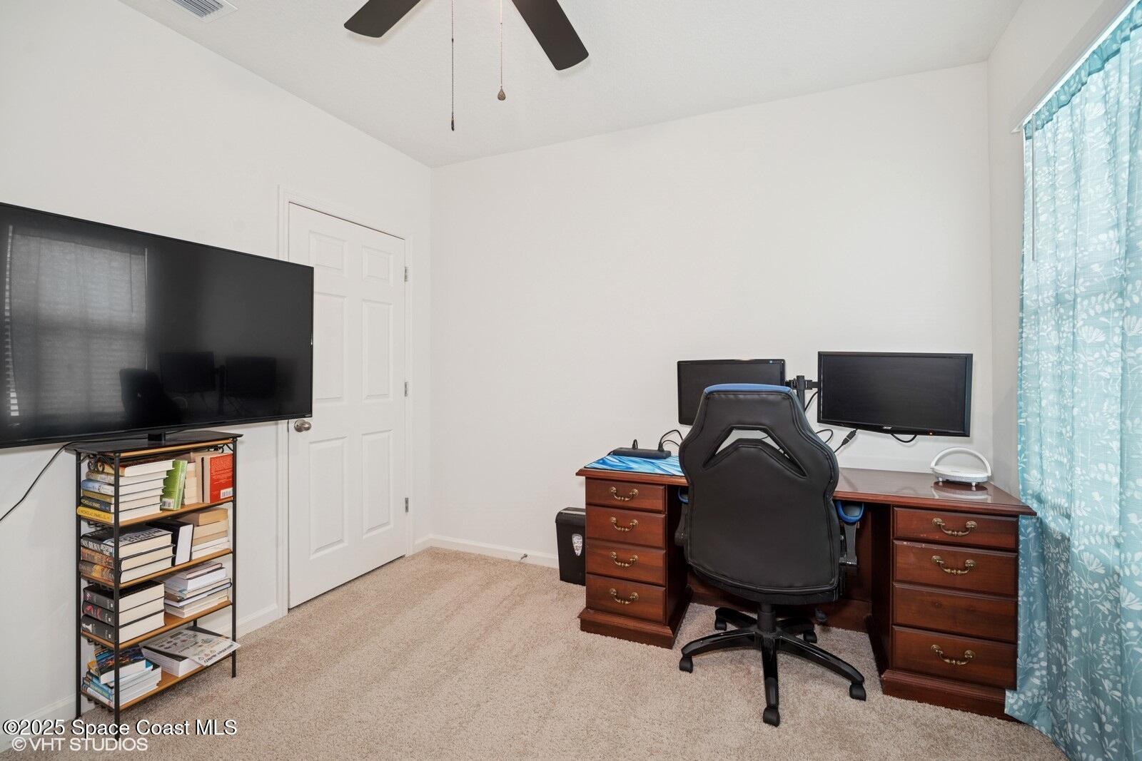 5221 Talbot Boulevard Cocoa, FL 32926 - Photo 23 of 32 a view of a workspace with furniture and a window