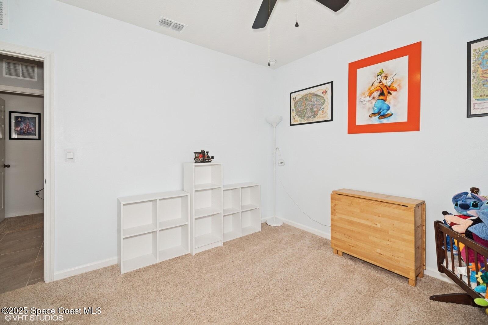 5221 Talbot Boulevard Cocoa, FL 32926 - Photo 25 of 32 a view of room with baby crib and cabinet