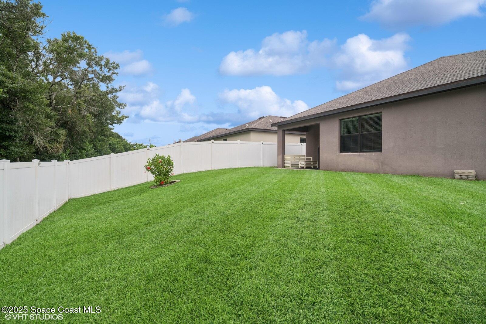 5221 Talbot Boulevard Cocoa, FL 32926 - Photo 30 of 32 a house view with a garden space