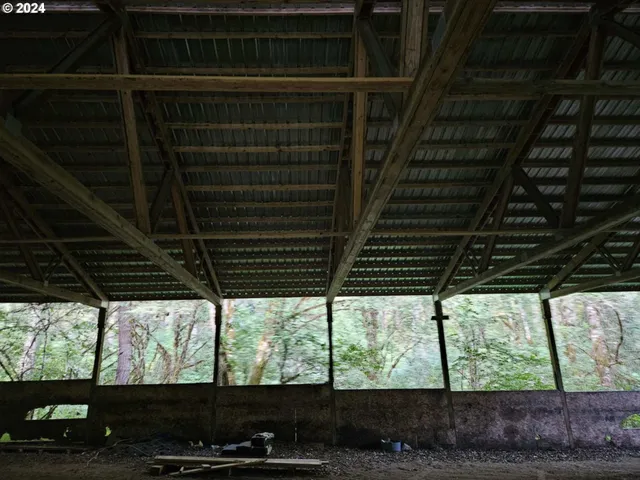 a view of room with wooden floor and outdoor space