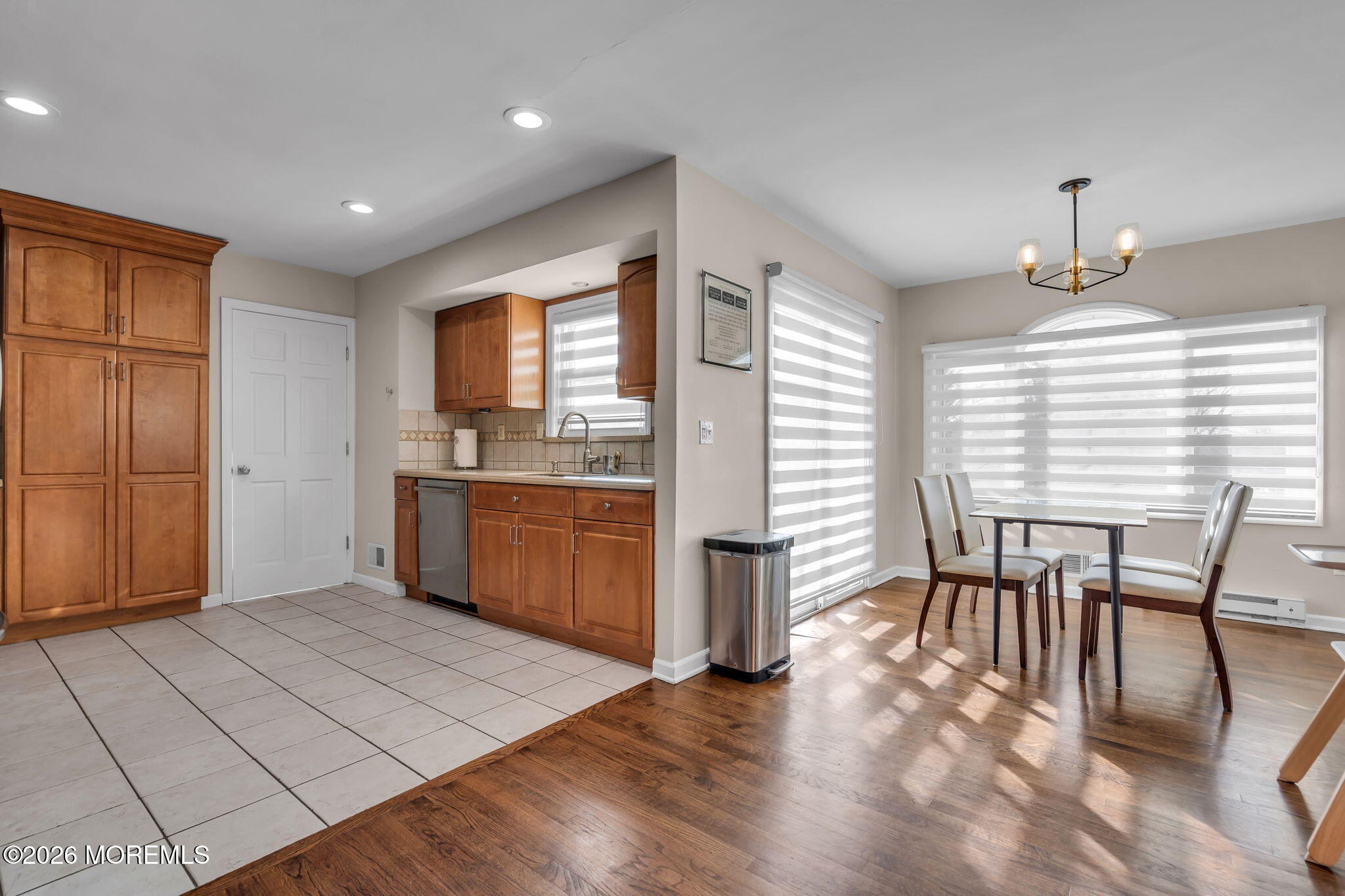 3 Bruce Terrace Jackson, NJ 08527 - Photo 34 of 37 a kitchen with stainless steel appliances granite countertop a stove a sink a refrigerator dining table and chairs