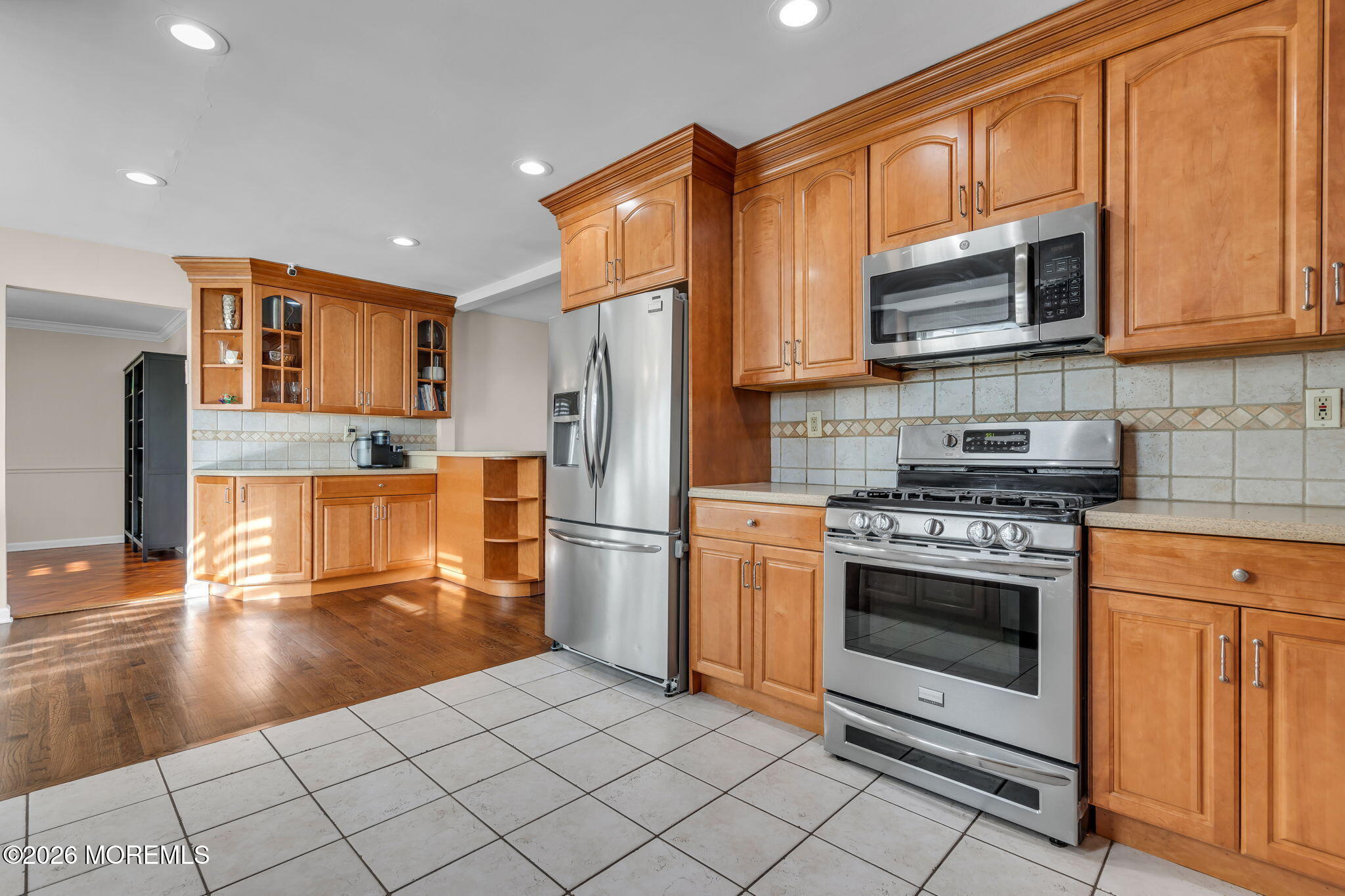 3 Bruce Terrace Jackson, NJ 08527 - Photo 4 of 37 a kitchen with stainless steel appliances granite countertop a stove a refrigerator and a microwave