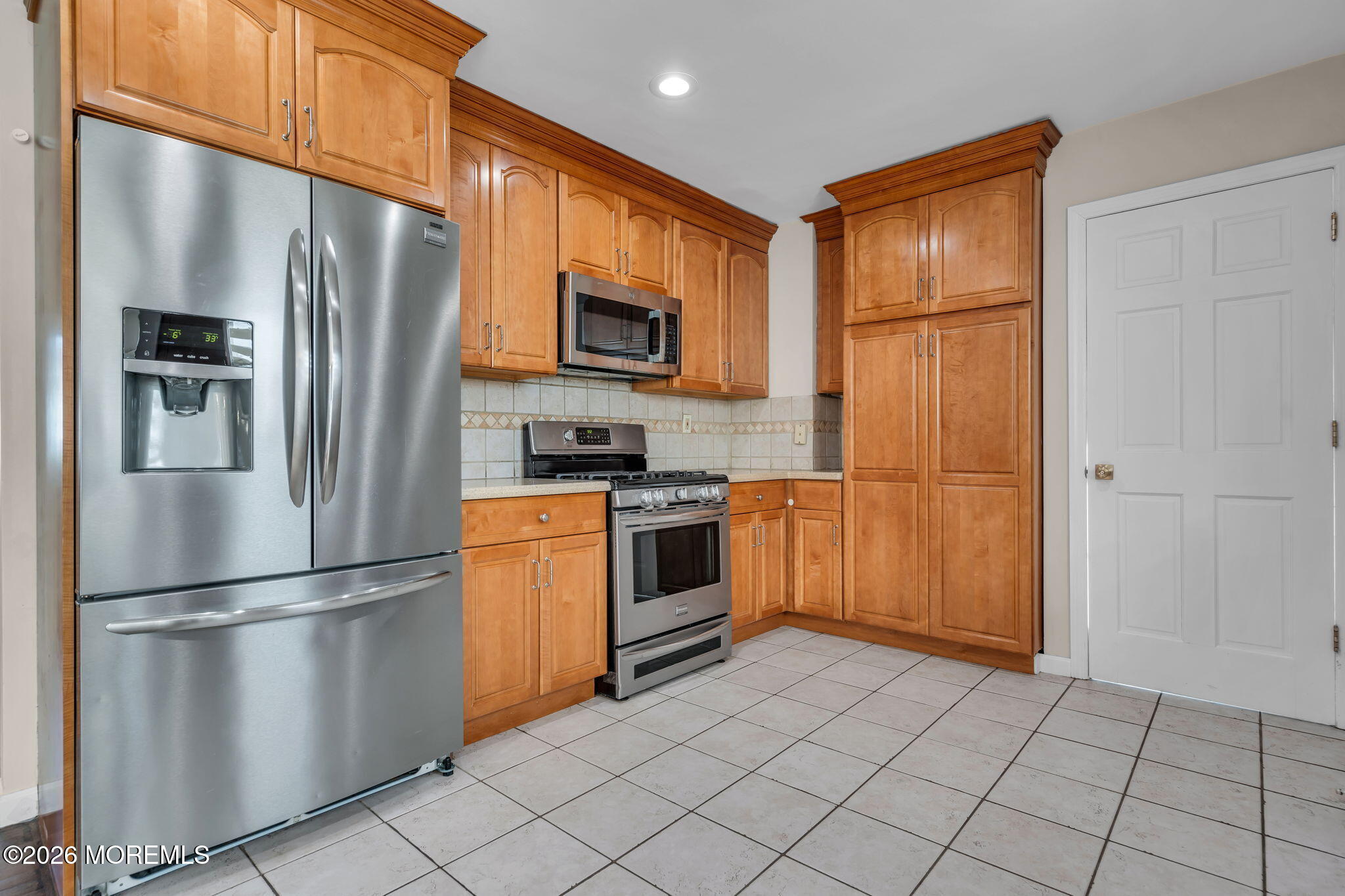 3 Bruce Terrace Jackson, NJ 08527 - Photo 8 of 37 a kitchen with stainless steel appliances granite countertop a refrigerator and a stove top oven
