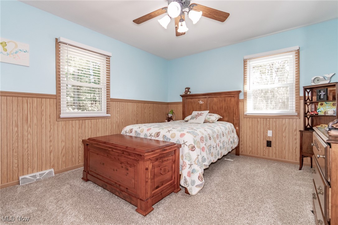 10495 Mulberry Road Chardon, OH 44024 - Photo 21 of 48 Bedroom with a wainscoted wall, and multiple windows