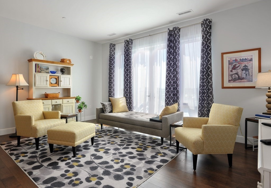 10 Shipyard Drive, Unit 401 Hingham, MA 02043 - Photo 12 of 24 a living room with furniture and a window