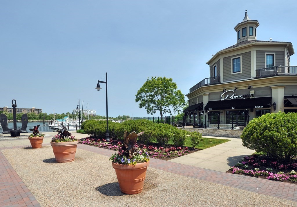 10 Shipyard Drive, Unit 401 Hingham, MA 02043 - Photo 23 of 24 a front view of a house with a garden