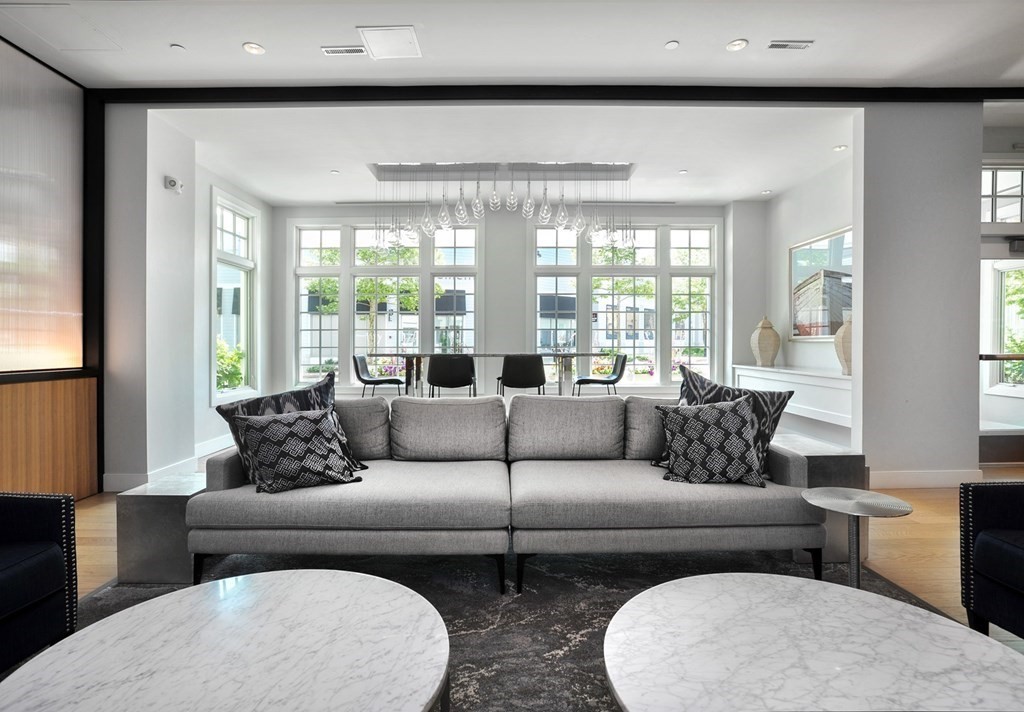 10 Shipyard Drive, Unit 401 Hingham, MA 02043 - Photo 3 of 24 a living room with furniture and a large window