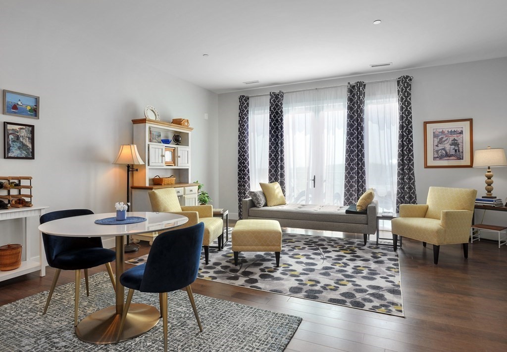 10 Shipyard Drive, Unit 401 Hingham, MA 02043 - Photo 10 of 24 a living room with furniture and wooden floor