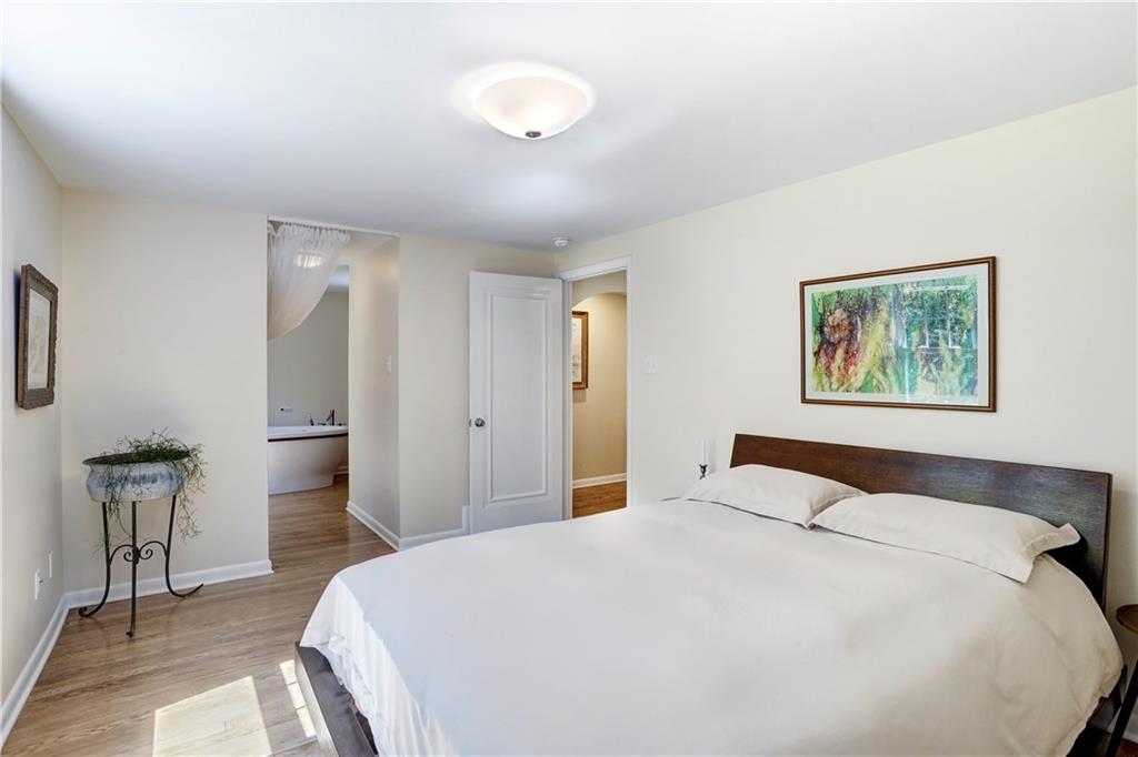 348 Scaife Road Sewickley, PA 15143 - Photo 14 of 25 a bedroom with a large bed and a chandelier