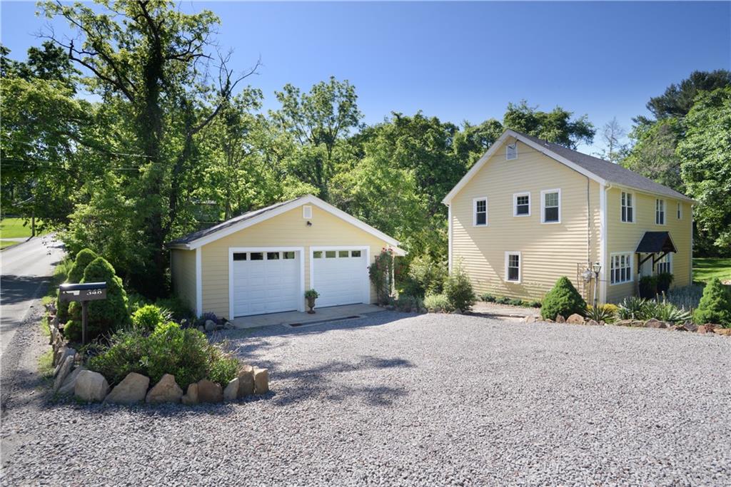 348 Scaife Road Sewickley, PA 15143 - Photo 21 of 25 a view of a house with a yard and potted plants