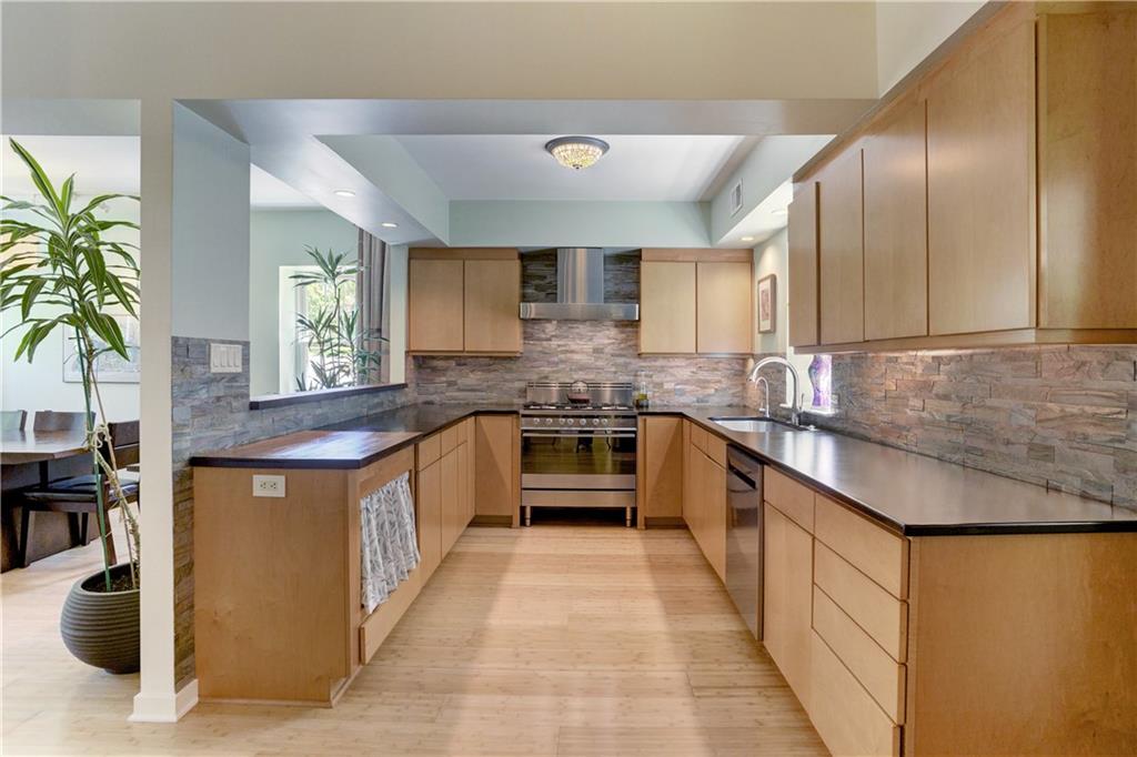 348 Scaife Road Sewickley, PA 15143 - Photo 8 of 25 a large kitchen with stainless steel appliances granite countertop a stove a sink and a refrigerator