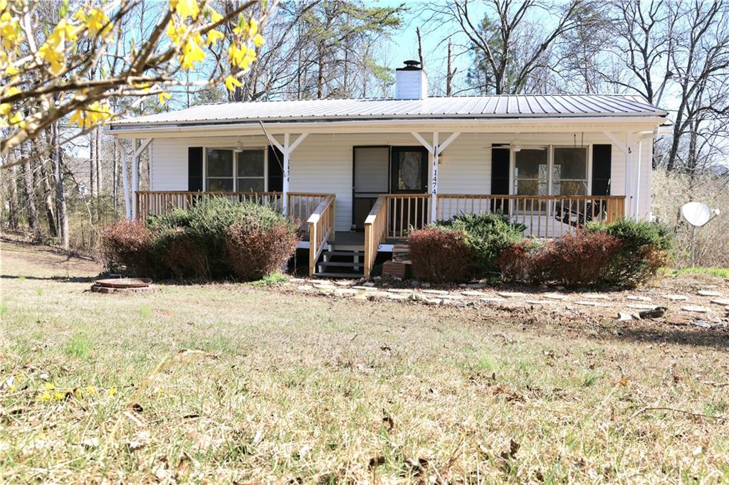 1474 Davis Road West Fairmount, GA 30139 - Photo 1 of 1 a front view of house with yard