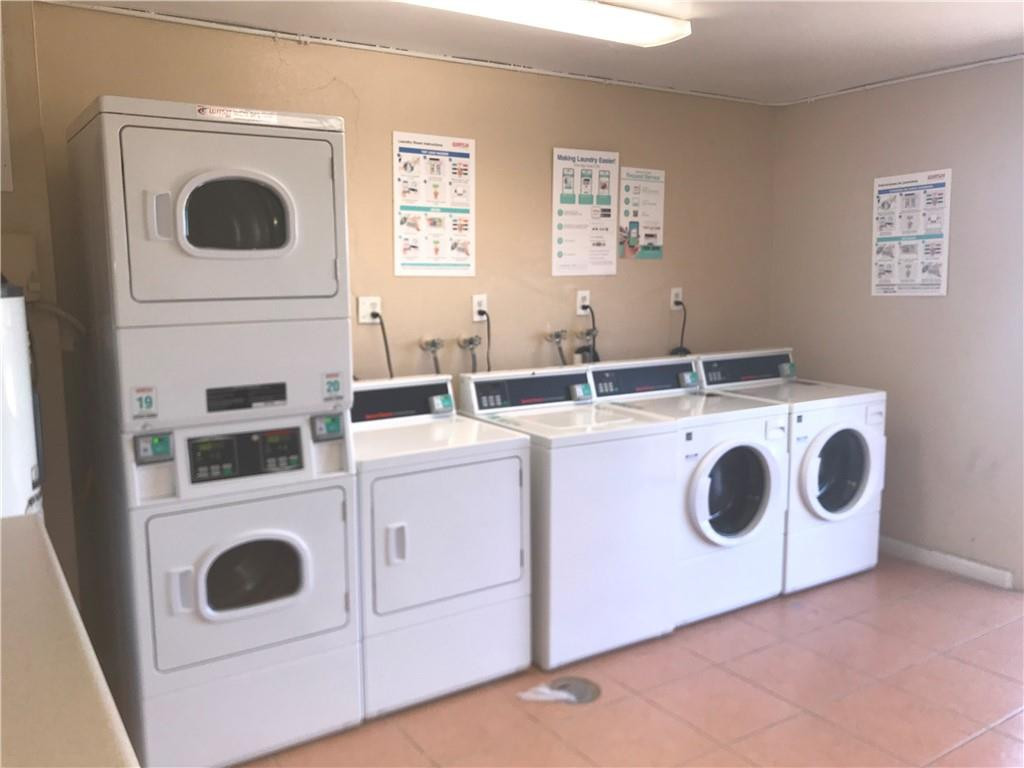 405 South Pine Island Road, Unit 401D Plantation, FL 33324 - Photo 7 of 13 a utility room with dryer and washer
