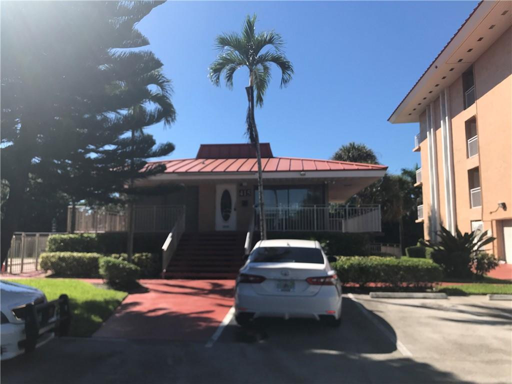 405 South Pine Island Road, Unit 401D Plantation, FL 33324 - Photo 10 of 13 a front view of a house with garden