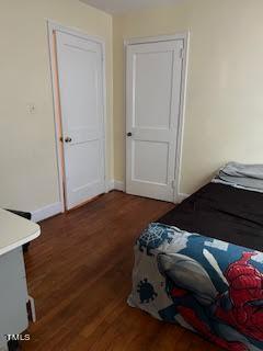 2204 Guess Road Durham, NC 27705 - Photo 11 of 15 a bedroom with a bed and hallway