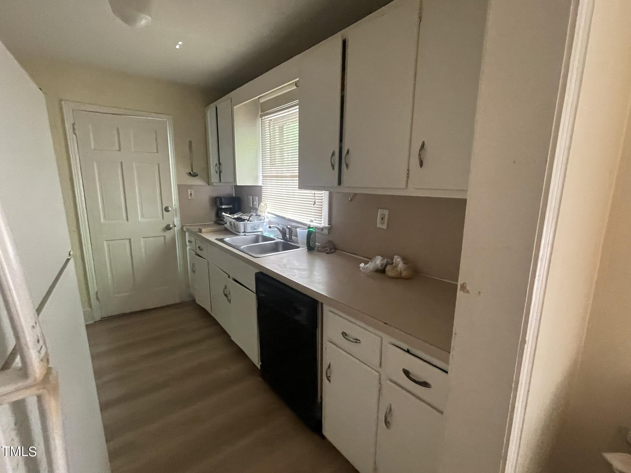 2204 Guess Road Durham, NC 27705 - Photo 3 of 15 a kitchen with stainless steel appliances a sink stove and cabinets