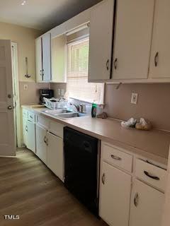 2204 Guess Road Durham, NC 27705 - Photo 5 of 15 a kitchen with granite countertop white cabinets and white appliances