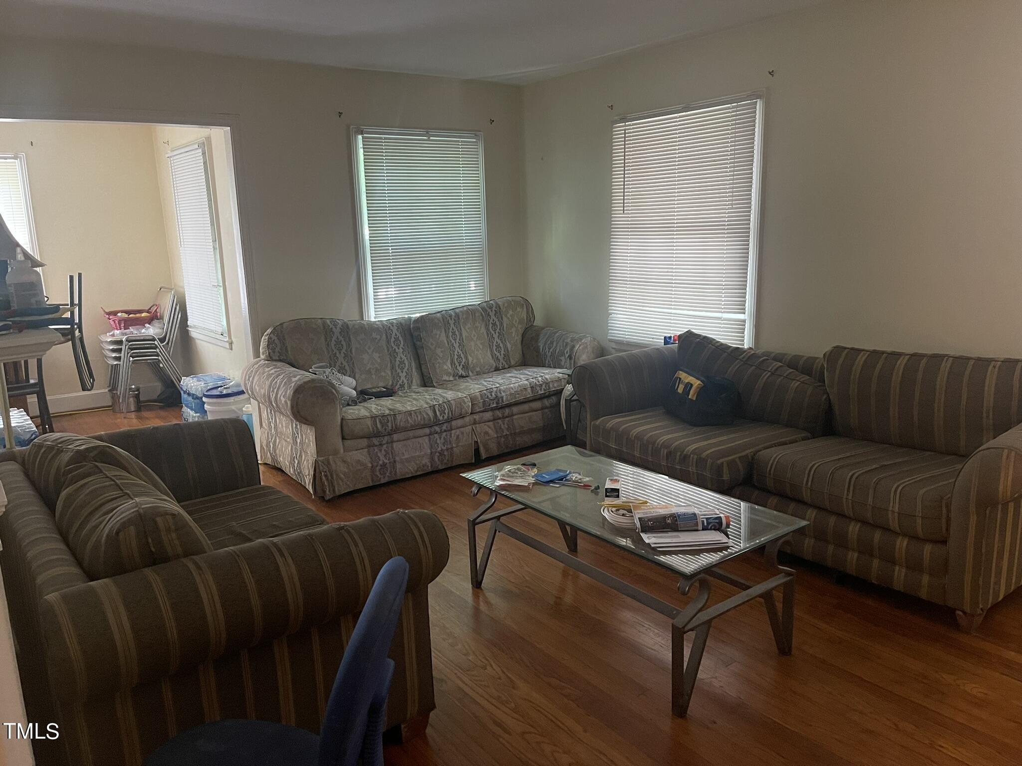 2204 Guess Road Durham, NC 27705 - Photo 8 of 15 a living room with furniture a couch and a window