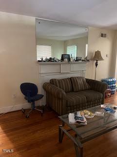 2204 Guess Road Durham, NC 27705 - Photo 9 of 15 a living room with furniture and a chair