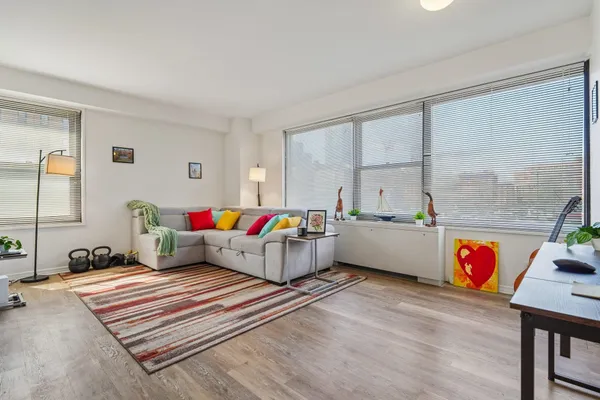 a living room with furniture and a table