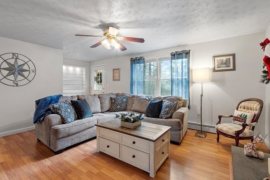 628 Teel Road Winchendon, MA 01475 - Photo 12 of 38 a living room with furniture and a large window