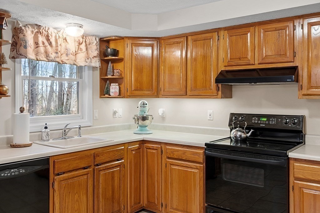 628 Teel Road Winchendon, MA 01475 - Photo 3 of 38 a kitchen with granite countertop cabinets stainless steel appliances and a window