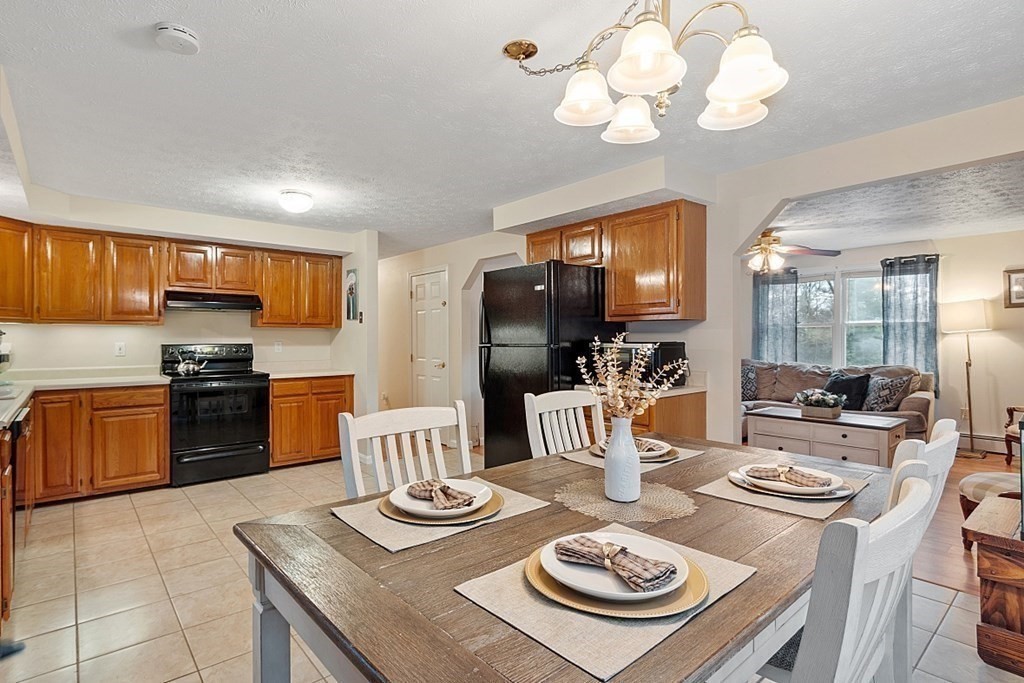 628 Teel Road Winchendon, MA 01475 - Photo 6 of 38 a kitchen with a dining table and chairs