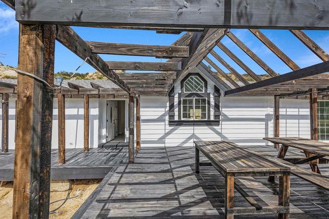 a view of a large body of water with a building in the background