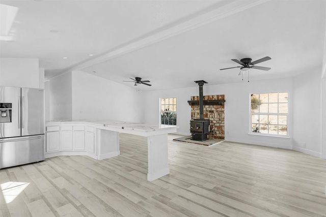 an outdoor view of fireplace and window