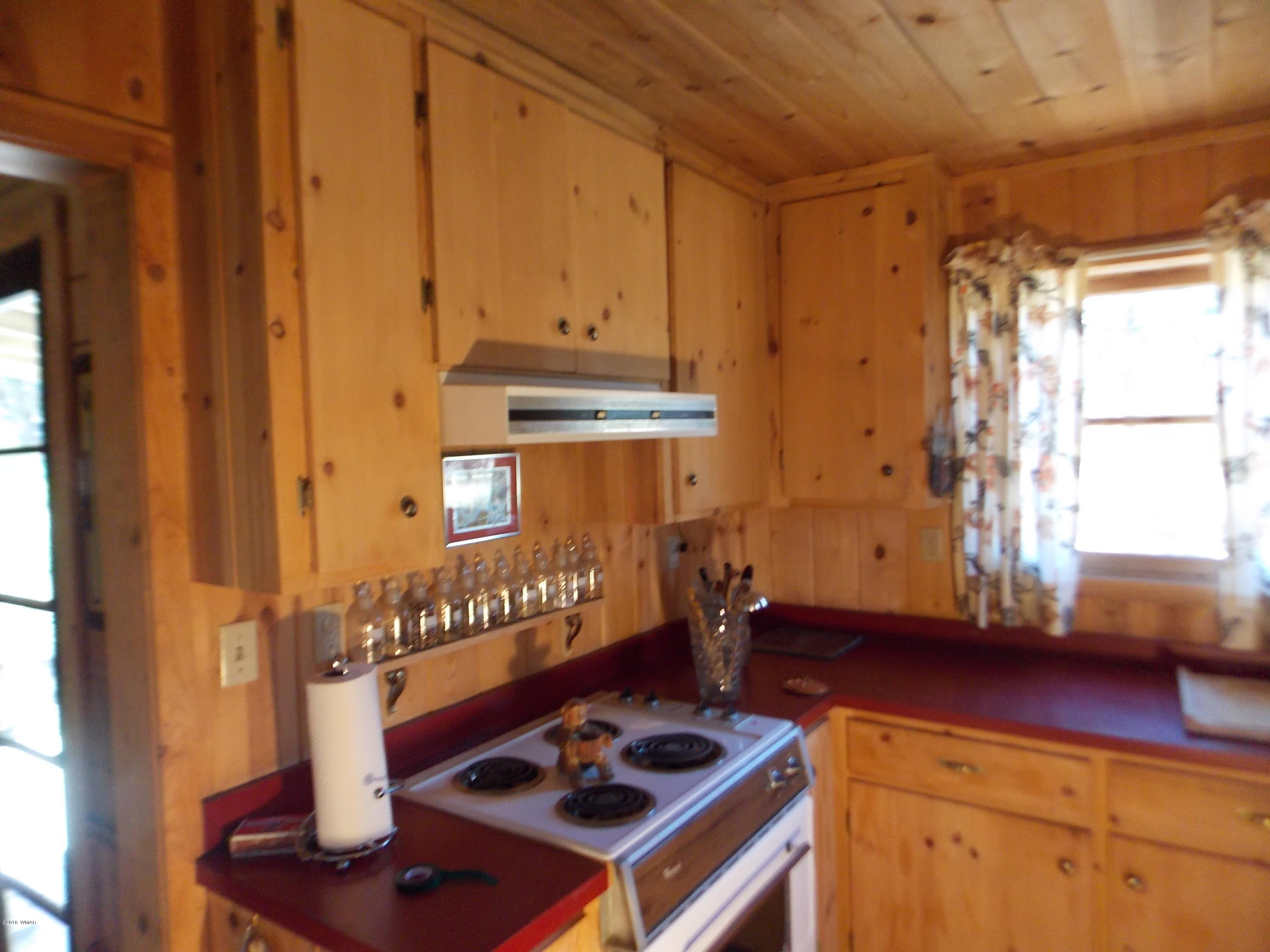 1830 Artist Draw Road Heber, AZ 85928 - Photo 8 of 29 a kitchen with a stove and a wooden cabinets