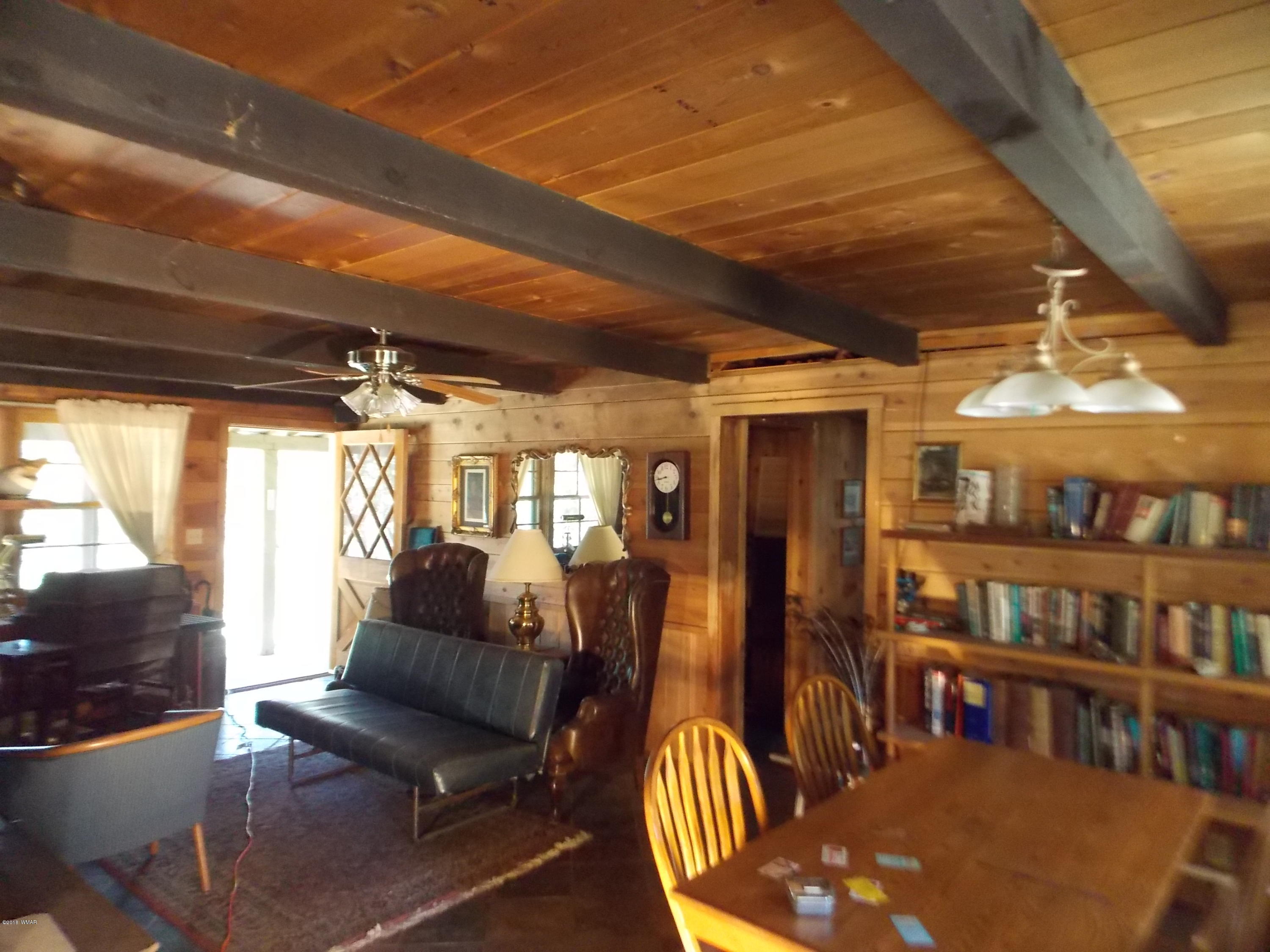 1830 Artist Draw Road Heber, AZ 85928 - Photo 10 of 29 a living room with lots of furniture and a book shelf