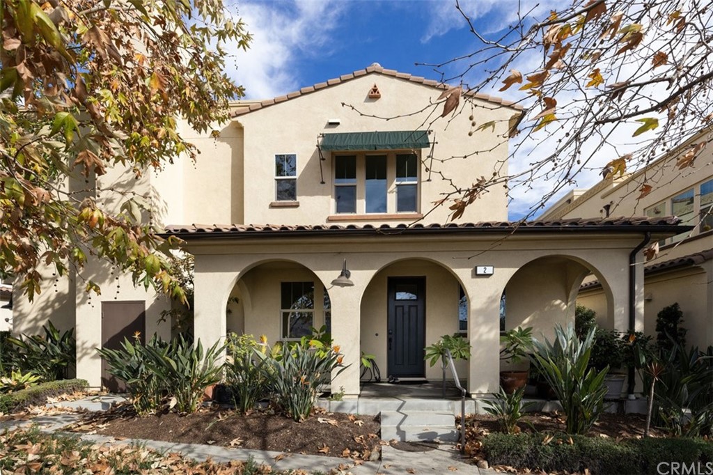 a view of front door and small plants